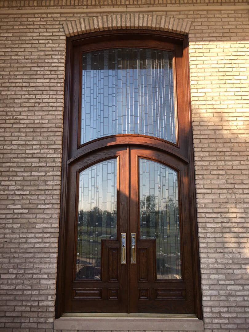 A door with two panels and one glass panel.