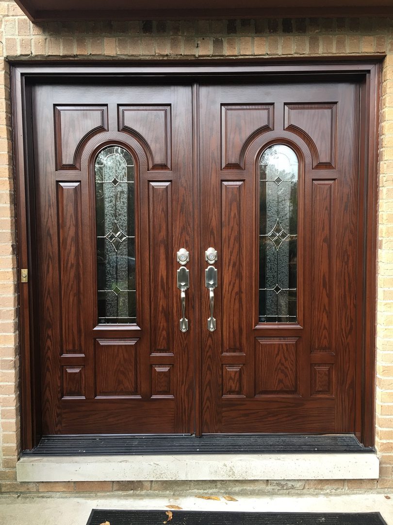 A double door with two windows and a metal handle.